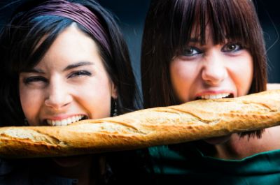 girls eating bread